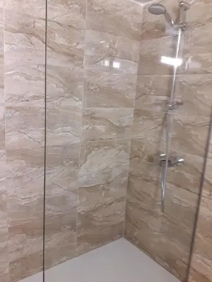 a bathroom with a shower with a glass door at P L Sunorama Beach Garden 302 in Larnaka