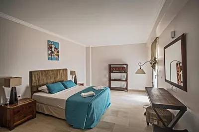 a bedroom with a bed and a table in it at Leana Front Line Villa in Protaras