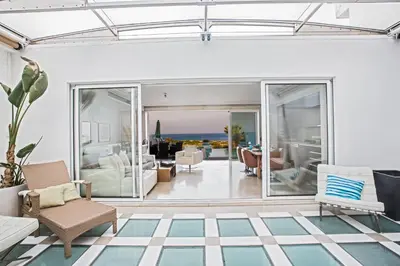 a living room with a view of the ocean at Leana Front Line Villa in Protaras