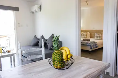a bowl of fruit on a table in a living room at Tikay Holiday Apts in Ayia Napa