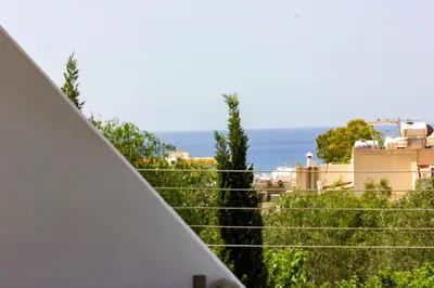 a view of the ocean from the balcony of a house at Tikay Holiday Apts in Ayia Napa