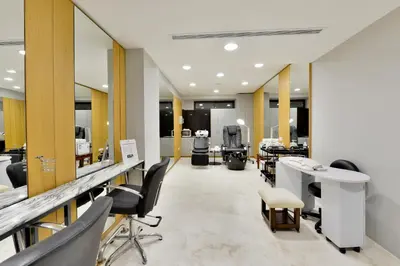 a salon with a row of mirrors and chairs at Napa Mermaid Hotel & Suites in Ayia Napa
