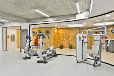 a gym with treadmills and ellipticals in a room at Napa Mermaid Hotel & Suites in Ayia Napa