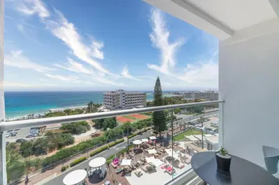 a balcony with a view of the beach and the ocean at Napa Mermaid Hotel & Suites in Ayia Napa