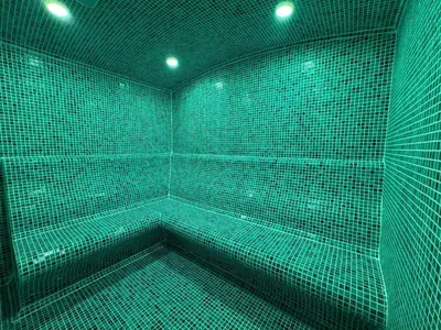 a green room with a tub with green lights at Corfu Hotel in Ayia Napa