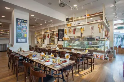 a restaurant with tables and chairs in a room at Hilton Nicosia in Nicosia