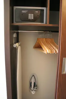 a microwave oven sitting on top of a shelf at Livadhiotis City Hotel in Larnaka