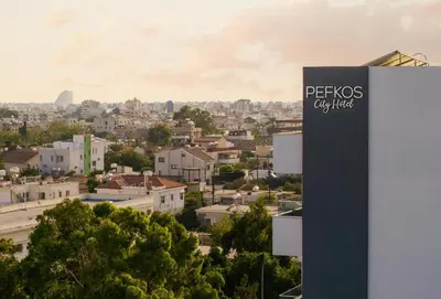 a sign that reads pepsi city cited at Pefkos City Hotel in Limassol