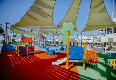 a playground with many different types of play equipment at Lordos Beach Hotel & Spa in Larnaka