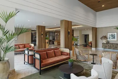 a living room with a couch and chairs at The GrandResort - Leonardo Limited Edition in Limassol