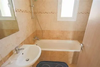 a bathroom with a white tub and a sink at Villa Florie in Protaras