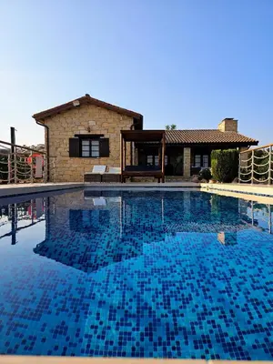 a large swimming pool in front of a house at Paradise Traditional House in Maroni
