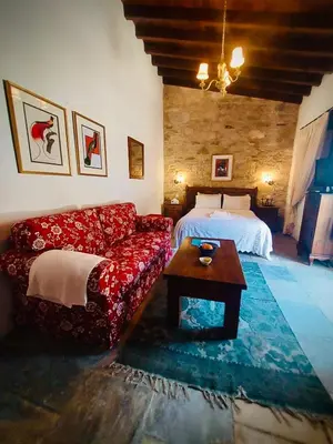 a living room with a couch and a bed at Niki's House in Limassol