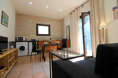 a living room with a couch and a dining room at La C Mer in Larnaka