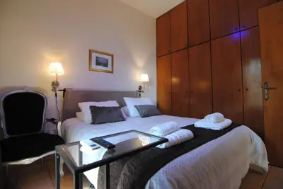 a bedroom with a bed with a glass table on it at La C Mer in Larnaka