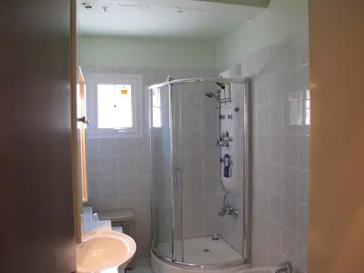 a bathroom with a shower and a toilet and a sink at Vergi Apartments in Pyla