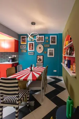 a dining room with a red and white table and chairs at Castle Holiday Apartments in Limassol