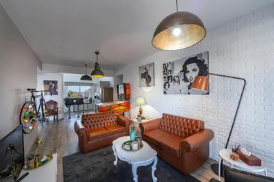 a living room with two couches and a table at Castle Holiday Apartments in Limassol