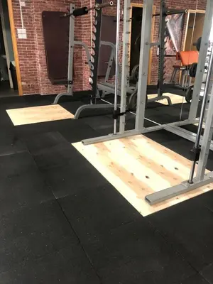 a gym with wooden flooring and a bunch of equipment at Alex Beach Apartment 31 in Larnaka