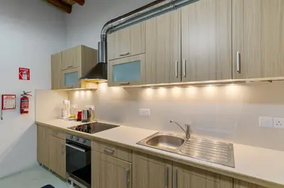 a kitchen with a sink and a stove at Annis House in Kato Lefkara