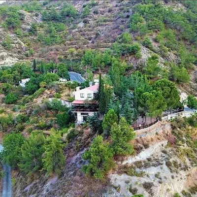 an aerial view of a house on a mountain at Perneia Rooms in Askas