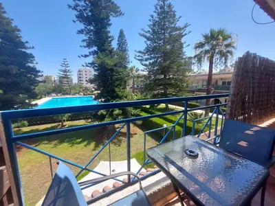 a balcony with a view of a swimming pool at Palm Beach Apartment 26 in Limassol