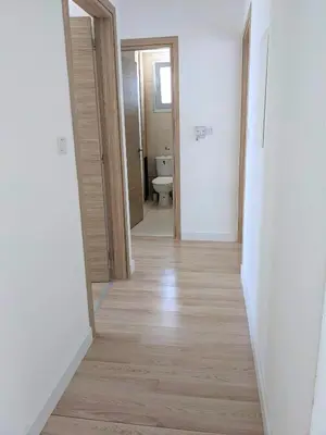 an empty hallway with a toilet in a room at T&E Villa in Larnaka