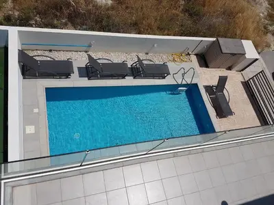 an image of a swimming pool on a building at T&E Villa in Larnaka