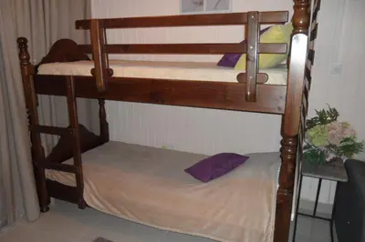 a couple of bunk beds in a room at Apartment Ground Floor, FREE INTERNET in Ayia Napa