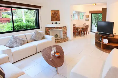 a living room with a couch and a table at Green Bay Villa in Protaras