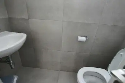 a bathroom with a toilet and a sink at Fig Tree Bay Villa 2 in Protaras