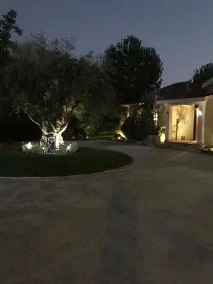 a driveway of a house at night with lights at Agia Mavri House in Koilani