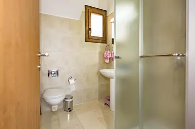a bathroom with a toilet and a sink at Greko Mare Front Line in Protaras