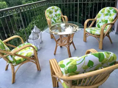 a group of chairs and a table on a patio at Riverside Suite in Kalopanayiotis