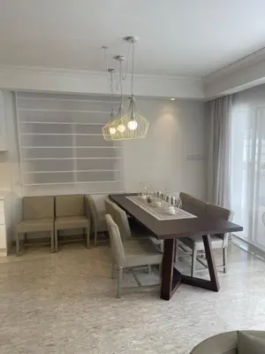 a dining room with a table and chairs at Serenity Villa Mediterranean in Pervolia