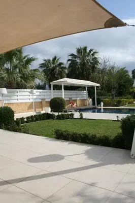 a view of a resort with a pool and a gazebo at Serenity Villa Mediterranean in Pervolia