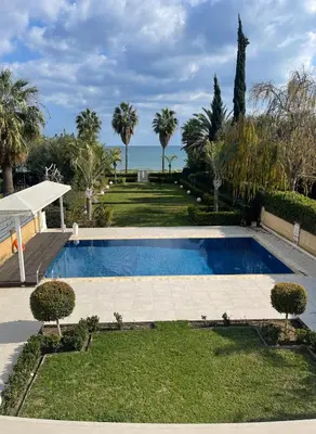 a swimming pool with a view of the ocean at Serenity Villa Mediterranean in Pervolia