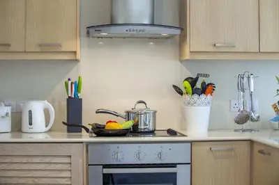 a kitchen with a stove with a pot on it at Passion Villa in Protaras