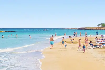 a group of people standing on a beach at Villa Anette in Protaras
