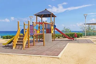 a playground on the beach with a slide at Villa Anette in Protaras