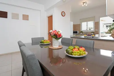 a kitchen with a table with fruits and vegetables on it at Villa Summer in Protaras