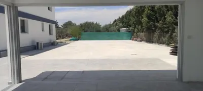 a view of a large patio from a window at Kiti Village Villa, Cyprus, salt-water pool, 5 bedrooms, Larnaca in Kiti