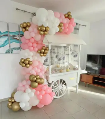 a balloon column with pink and white balloons and a cart at Kiti Village Villa, Cyprus, salt-water pool, 5 bedrooms, Larnaca in Kiti