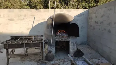 a pizza oven with a fire inside of it at Kiti Village Villa, Cyprus, salt-water pool, 5 bedrooms, Larnaca in Kiti