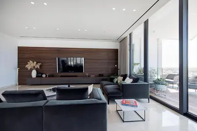 a living room with two couches and a tv at Nicosia Central Park Residences in Nicosia