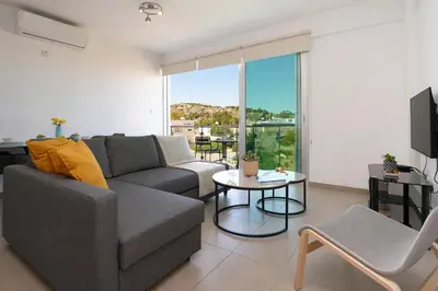 a living room with a couch and a table at Apartment Victoria in Protaras