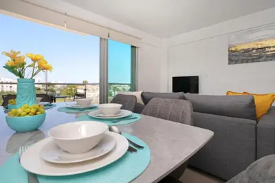 a living room with a table and a couch at Apartment Victoria in Protaras