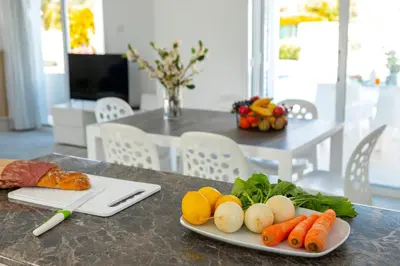 a plate of vegetables sitting on a table at Fig Tree Bay Villa 3 in Protaras
