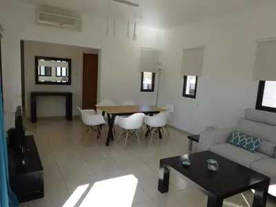 a living room with a couch and a table at Cy-Blue in Protaras