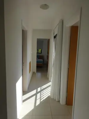 a hallway with white walls and a hallway with a room at Cy-Blue in Protaras